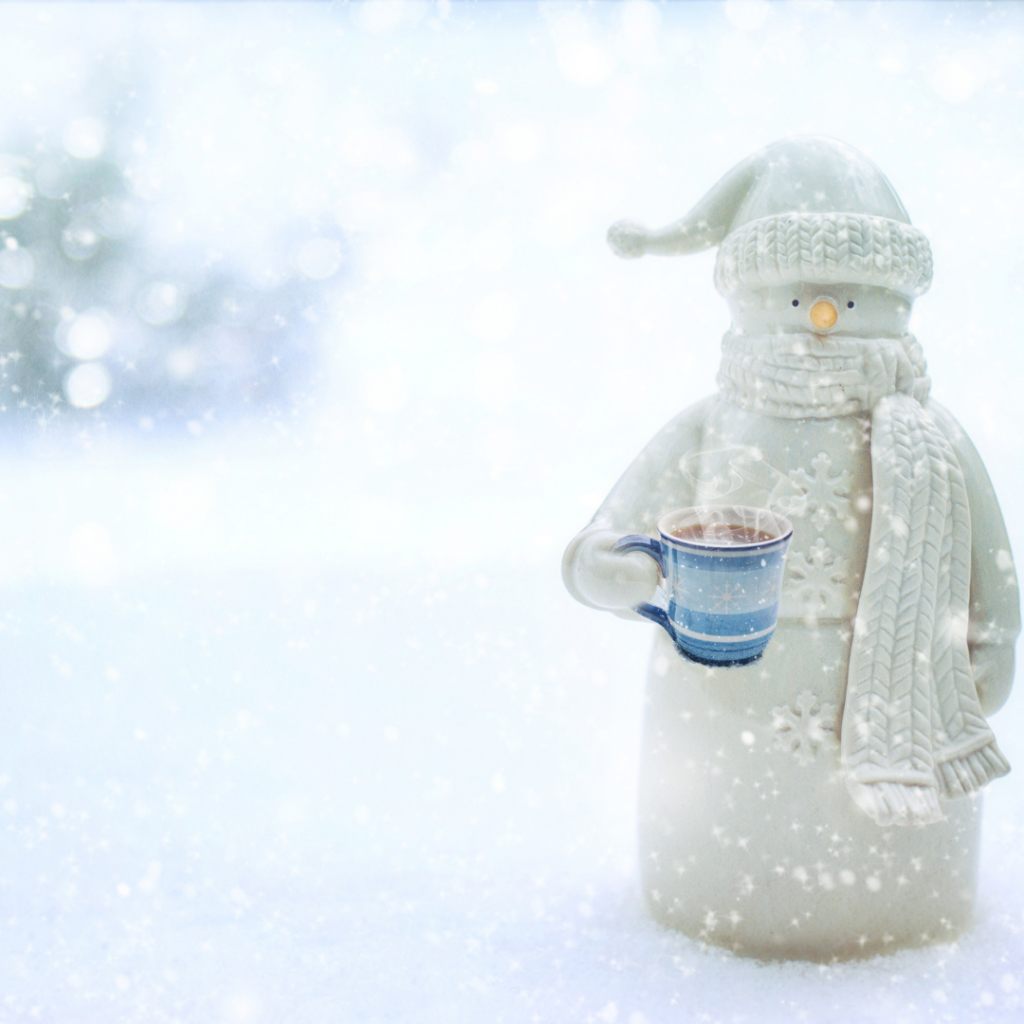 A care captains snowman keeping warm in the snow